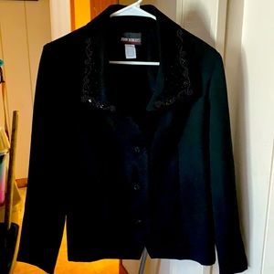 Elegant sequin Jacket by John Robert’s with shoulder padding and matching skirt.